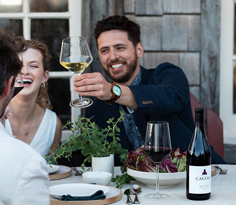 Calera Wines on a table being enjoyed by friends and family
