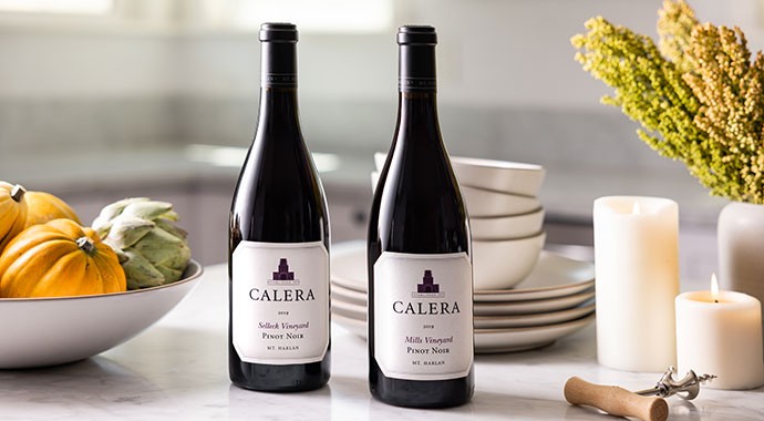 Calera wines on kitchen counter with bowl of mini pumpkins