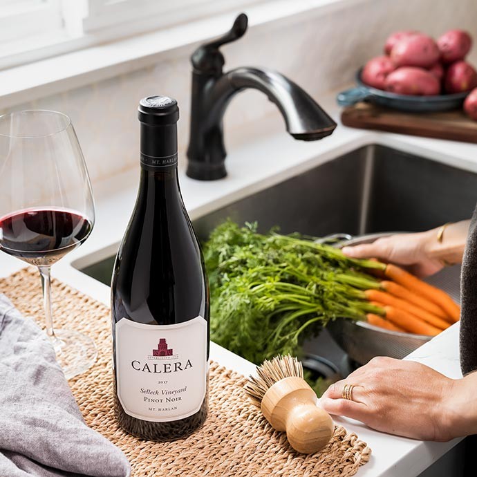 Calera Selleck Pinot Noir next to a sink with Veggies