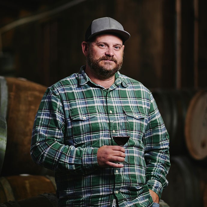 Mike Waller holding a glass of wine