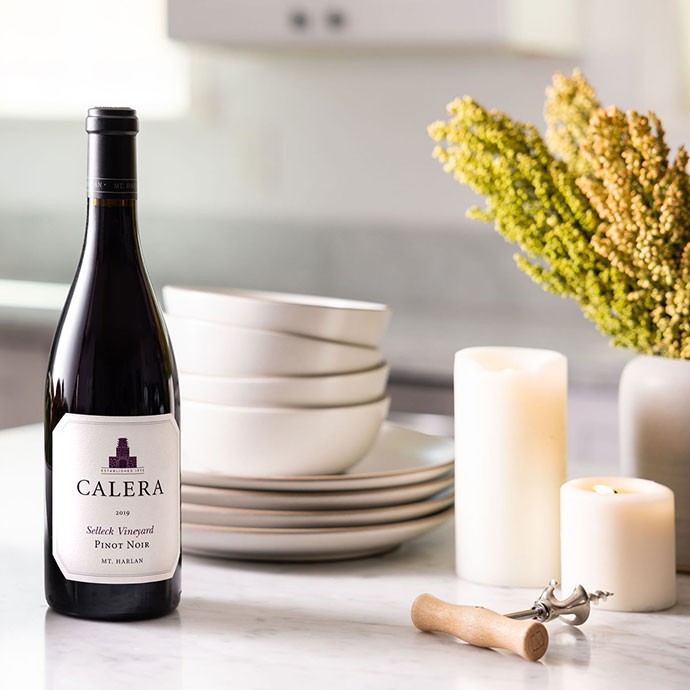 Calera wine on kitchen counter with candles
