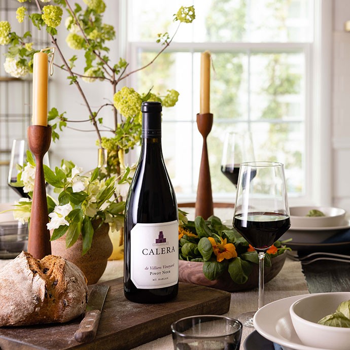 Calera wine bottle on dinner table