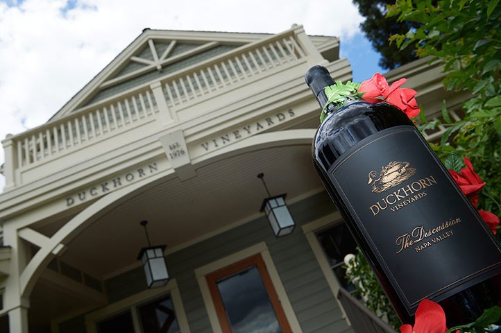 Bottle of Discussion in front of Duckhorn Vineyards