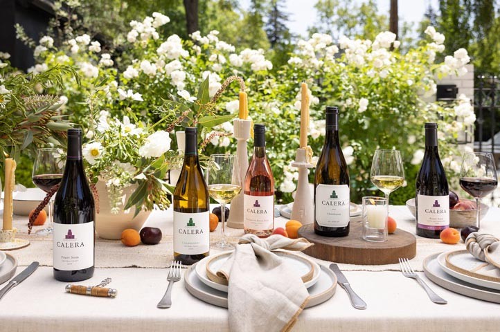 Calera dinner table with bottle and table settings