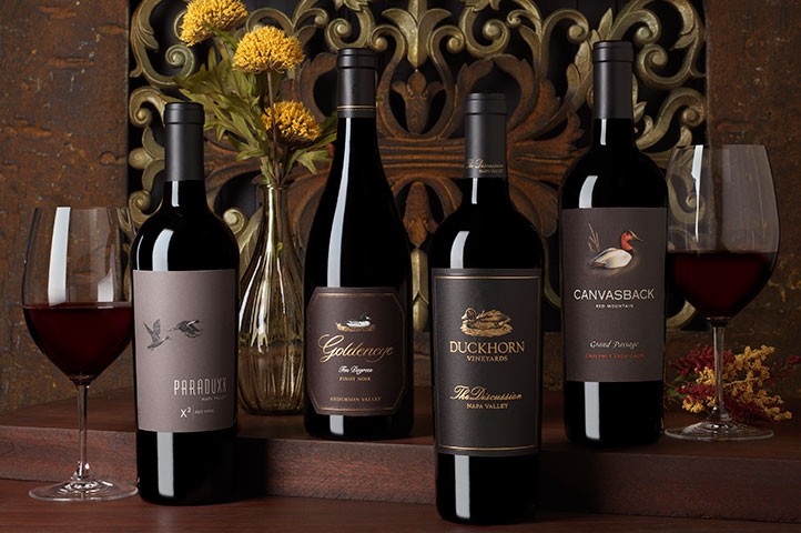 Duckhorn Portfolio's Pinnacle wines with two glasses of wine